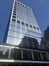 Glass Towers, such as the one across the street from Madison Square Garden on W. 31st St. could still ring Penn Station and MSG in the future, state officials says. This one has an indoor pickleball court on the ground floor.