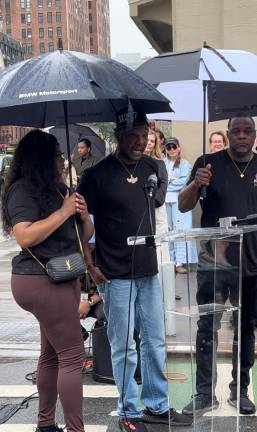 Henderson’s bereaved siblings attended the corner-naming ceremony. From left to right: Kamika, Jermaine, and Earl.