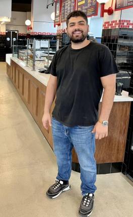 Utopia Bagels co-owner Jesse Spellman. His father, Scott, a partner in the Whitestone, Queens location, began making bagels at age 14.