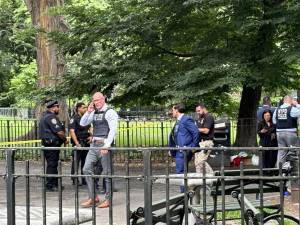 <b>Police investigate a double shooting that occurred inside Tompkins Sq. Park on July 12 that left a 74 year-old man dead and a 44 year-old man wounded.</b> Photo: Keith J. Kelly