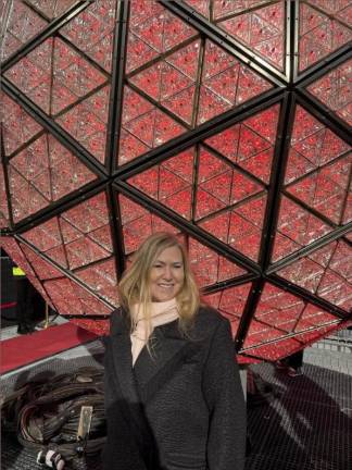 Sherri White, an executive at the developer Jamestown which owns One Times Square, led a press tour to the top of the inconic building in advance of the New Year’s Eve ball drop. The building is in the final phase of a massive $500 million renovation. She said by next summer the renovations will feature a wrap around observation deck and a Times Square Museum.