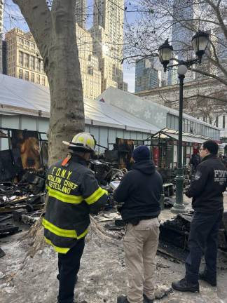 Firefighters responding to a blaze that tore through the Bryant Park holiday market on Dec. 27.