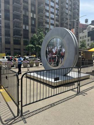 The NYC portal that is in NYC’s Flatiron District at the junction of Broadway, Fifth Avenue and 23rd Street that connects to Dublin at the corner of North Earl Street and O’Connell Street, the city’s main street. The portal now has a gate that was reopened on May 19 and will be on livestream for visitors from 6 AM to 4 PM in NYC. Police and Flatiron NoMad organizers now patrol the area for safety. Photo Credit: Alessia Girardin.