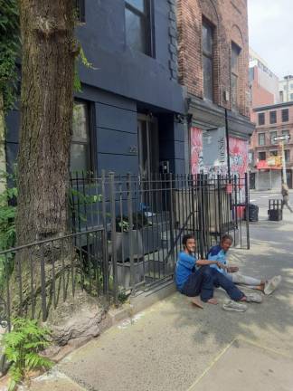 Two homeless regulars set up camp outside 203 West 22nd St.