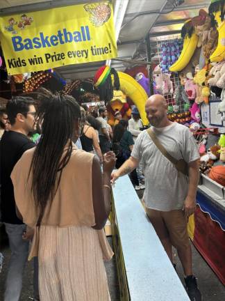 The festival banned outright gambling booths years ago but there are still plenty of games of chance to be had, such as this one which guarantees that kids win prizes everytime.