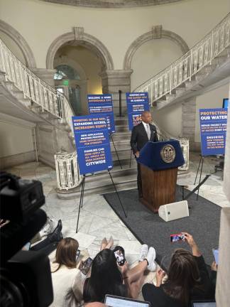 Mayor Eric Adams addresses the press at his weekly media avail on Oct. 1 which switched out of the normal press briefing in the Blue Room into the rotunda at City Hall. Many in the overflow press crowd sat on the floor or operated behind the bank of tv cameras. Adams, who is usually flanked by a host of deputy mayors, faced the press solo.