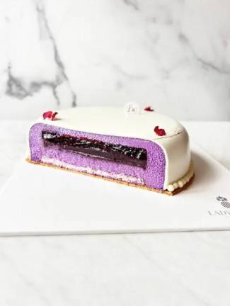 Viral Ube Blackberry Cake, made with layers of a ube mousse, blackberry compote, ube cremeux, and vanilla cake Photo Credit: Lady Wong