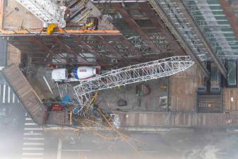 The aftermath of a crane collapse at 550 10th Ave. in Hell’s Kitchen, when a fire in the entry compartment led to sixteen tons of concrete plummeting nearly fifty stories to the street. 11 people were injured, including two firefighters, although no fatalities were reported.