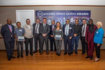 The 2024 Building Service Worker Award Honroees with NY1’s Errol Louis (left) and Straus Media President Jeanne Straus (right) Photo: Steven Strasser