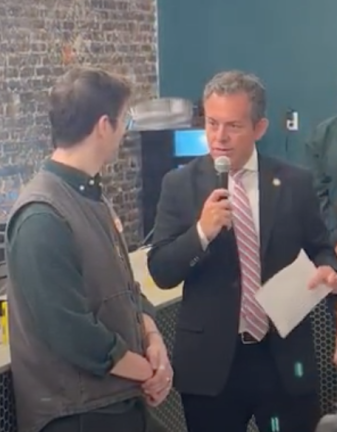 District 75 State Assemblymember Tony Simone addressing Ellis Soodak. Soodak is the co-owner of Verdi Cannabis, Chelsea’s first legal recreational weed store, which opened on Jan. 26.