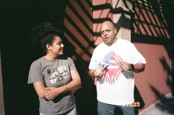 Director Taylor Hosking interviews her godfather Arthur Smith for the film at the Puerto Rican Day Festival.