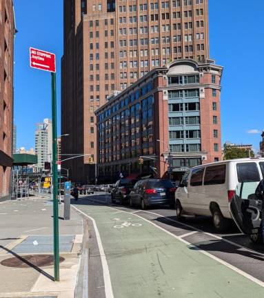 The 6th Ave. protected bike lane looking towards White Street and Roxy Hotel. October 10, 2024.