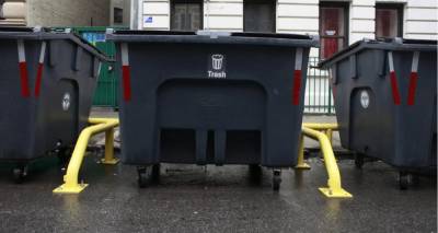 The city’s new trash containers sit on 148th Street between Broadway and Amsterdam Avenue, April 12, 2024 during a pilot program conducted by the Sanitation Dept. in Hamilton Heights. Now DOS wants to extend the pilot to West Harlem.