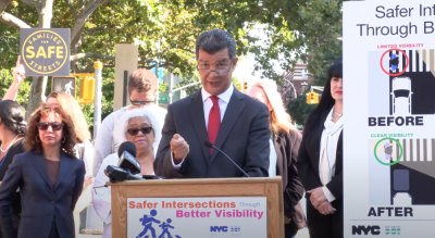 DOT Commissioner Ydanis Rodriguez, center, speaking at a September 3 press conference about intersection “daylighting” improvements. The city is on track to daylight 1,000 NYC intersections by the end of 2024, he said.