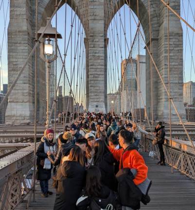 Throngs of tourists and pedestrians were on the Brooklyn Bridge on Dec 8, 2024.