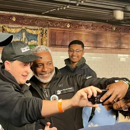 Newly appointed NYC Transit President Demetrius Chrichlow (center) takes a selfie with a transit enthusiast before the departure of the Nostalgia Train. Chrichlow rode the train up and back to the Bronx.