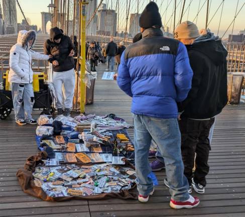 Just in time for Christmas, the illegal street vendors are swarming the Brooklyn Bridge once again.