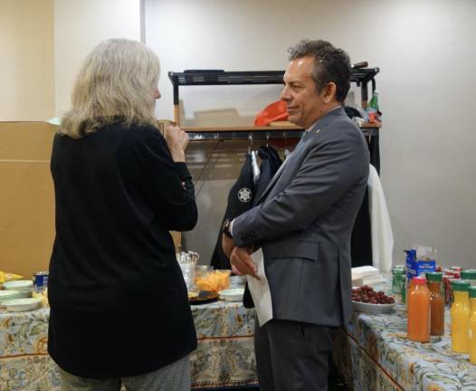 Assembly member Tony Simone listens to constituent’s concerns at the semi-annual meeting of the Chelsea West 200 Block Association.