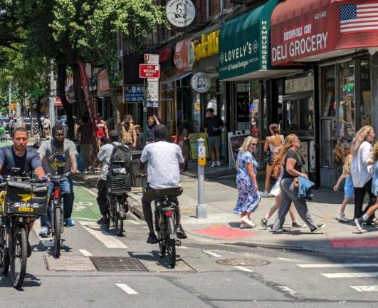 Bikers this summer were caught going every which way in a one-way bike lane that crosses a pedestrian crosswalk on Ninth Avenue. The disregard of traffic laws is dangerous, says the writer, who was knocked down by a biker going through a light.