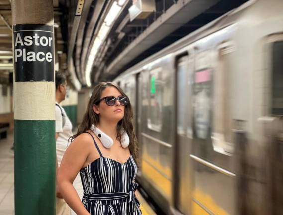 One subway rider told us she carries her own battery powered mobile fan (seen here around around her neck) to beat the heat when traveling the subway system.