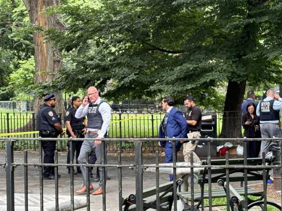 Police swarmed the southern end of Tompkins Square Park on the East Village on the day of the double shooting on July 12 that left one person dead and another seriously wounded.