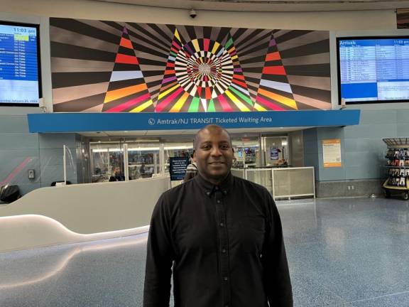 Rico Gaston, pictured here, chatted with Straus News about his newest commission, Untitled (Collective Light Transfer). The piece is on view on the upper level halls at Penn Station, through the Summer,