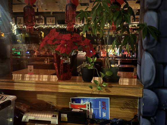 A few stray poinsettias can be seen inside the Abbey Tavern, which closed its doors for the last time on Jan. 20 ending a 50 year run in Gramercy Park.