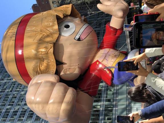 <b>High winds drove the ballon character Monkey D. Luffy from the live action Netflix animee series “One Piece: into a tree branch, causing its signature wide brimmed straw hat to deflate.</b> Photo: Keith J. Kelly