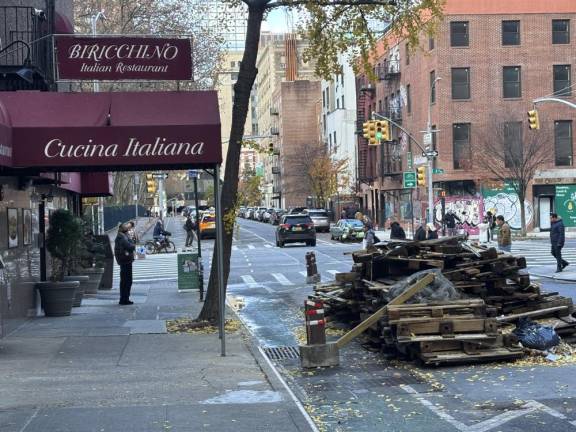 A torn-down dining shed outside Cucina Italiana, a restaurant in Chelsea. Remaining roadside dining sheds in NYC were supposed to come down for the winter on Nov. 29.