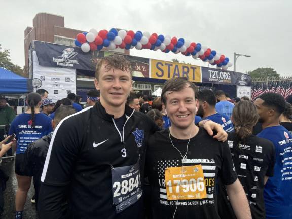 Tunnel-to-Towers participants from Manhattan, Eamon Kelly (left) and Sean O’Reilly, meet up at the start of the run.