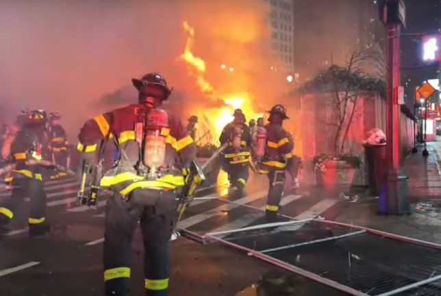 Firefighters responding to an early-morning blaze at the Herald Square Holiday Market on Monday, Dec. 16. One firefighter was seriously injured.