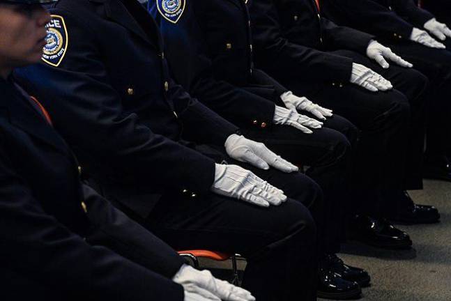 Twenty MTA Police Officers celebrate the completion of the Recruit Training Curriculum with “Gun and Shield Day” at the NYPD Academy on Wednesday, Oct 12, 2022. These recruits had to complete a 1.5 mile run in under 14 minutes and 21 seconds. But that standard has been scrapped for the new recruits now graduating.