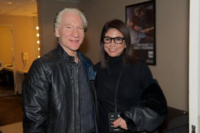 Caroline Hirsch (right) co-founder of the New York Comedy Festival, with comedian Bill Maher, who is among the headliners at this year’s shows which starts Nov. 7 at the Apollo.