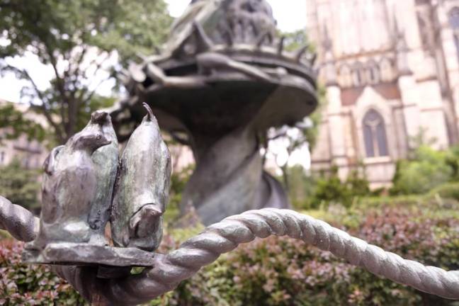 Small bronze sculptures around the Peace Fountain located at 1047 Amsterdam Avenue designed by children and their stories about what they thought was important. Photo: Beau Matic.