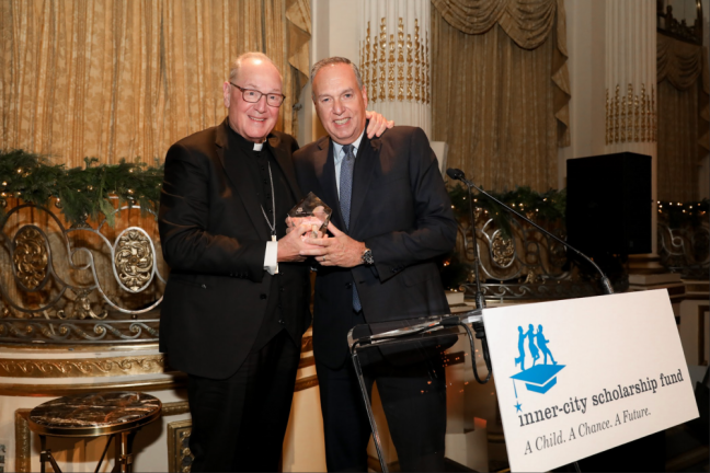 Stephen J. Squeri, Chairman and CEO of American Express (right), with Cardinal Dolan (left)