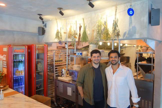 Co-Owners Harry Nicolaou and John Antokas in the kitchen of their new restaurant, Tziki Souvlaki, which just opened in Chelsea.