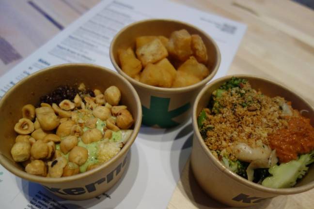 Clockwise from top: Crispy Potatoes, Roasted Broccoli and Cauliflower with Black Lentils and Hazelnuts