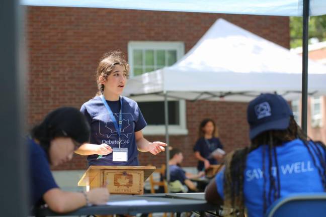 A kid at Debate Camp.