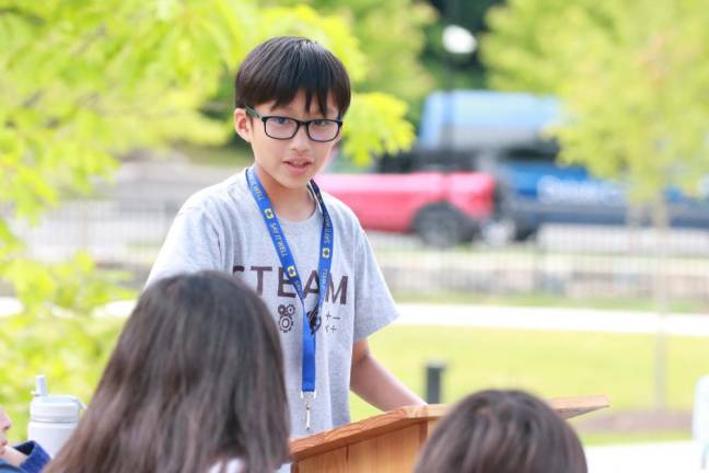 A kid at Debate Camp.