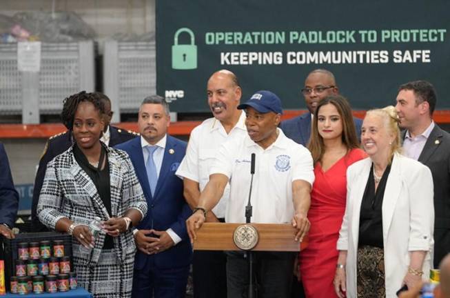 Mayor Eric Adams (at mic) was accompanied by, among others, City Council Member Gale Brewer (second from right), who has made fighting illegal weed shops a cause célèbre. Adams announced the task force has shut down close to 800 illegal smoke shops in a three-month crackdown.