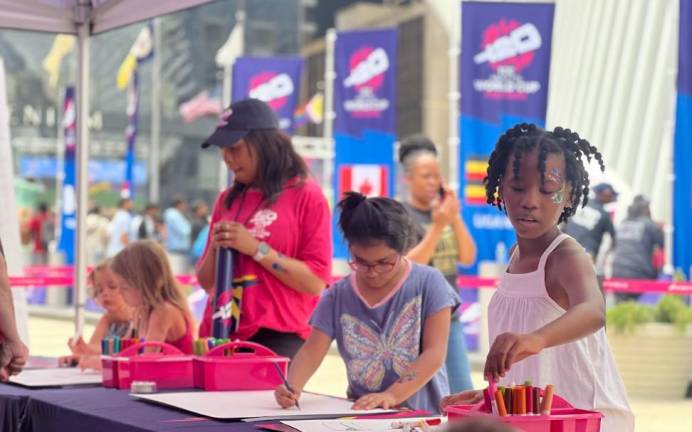 Organizers set up finger painting booths to keep the kids entertained while adults watched the Cricket T20 World Championship on June 29 at the Oculus. Photo: Maksuda Aziz