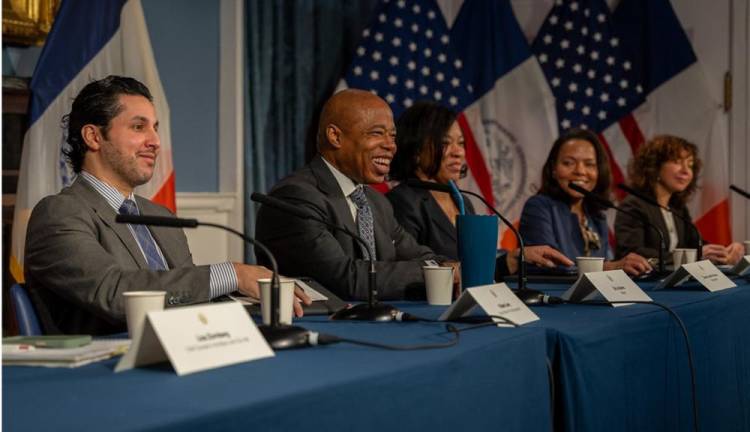 <b>Mayor Eric Adams shares a rare light moment with reporters and staffers as he defends the city’s work in the migrant crisis, crime, jobs and housing and insists he is not bothered by his recent poor poll numbers.</b> Photo: Office of the Mayor