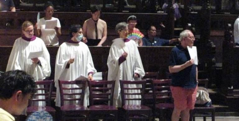 <b>Clergy join in the rehearsal for the Pride Choral Evensong at the Cathedral of St. John the Devine.</b> Photo: Carrene Gepilano.