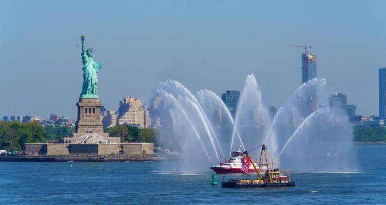 Fire boats greeted US Navy, Coast Guard and two German Navy boats as they sailed past the Statue of Liberty into New York Harbor on May 22. Photo: Benny Polatseck, Mayoral Photography Office